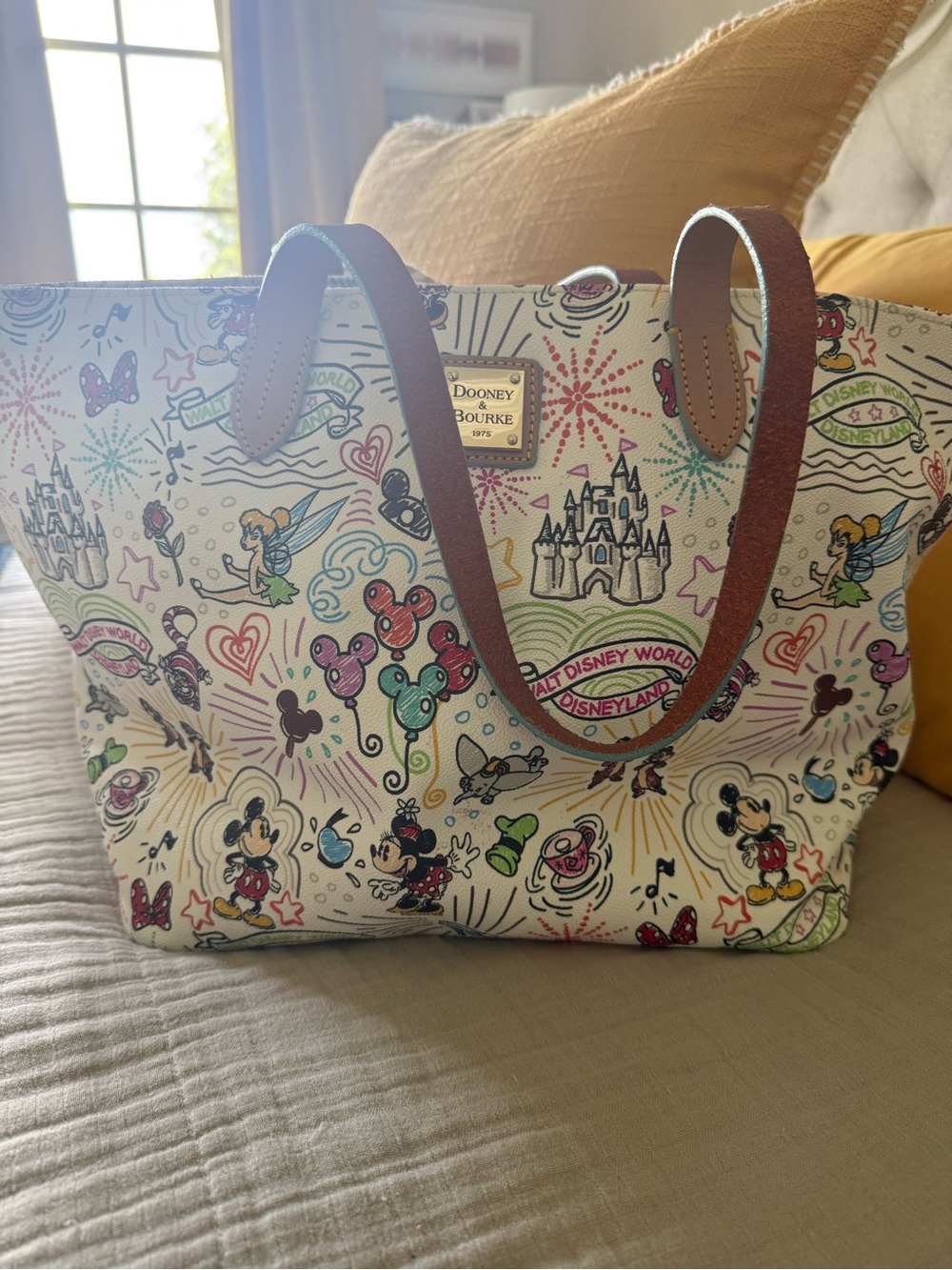 Dooney & Bourke Cream Multicolor Disney Sketch Tote with Brown Leather Straps